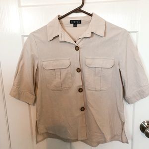 Tan button up shirt.